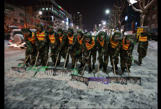 korean military shoveling snow